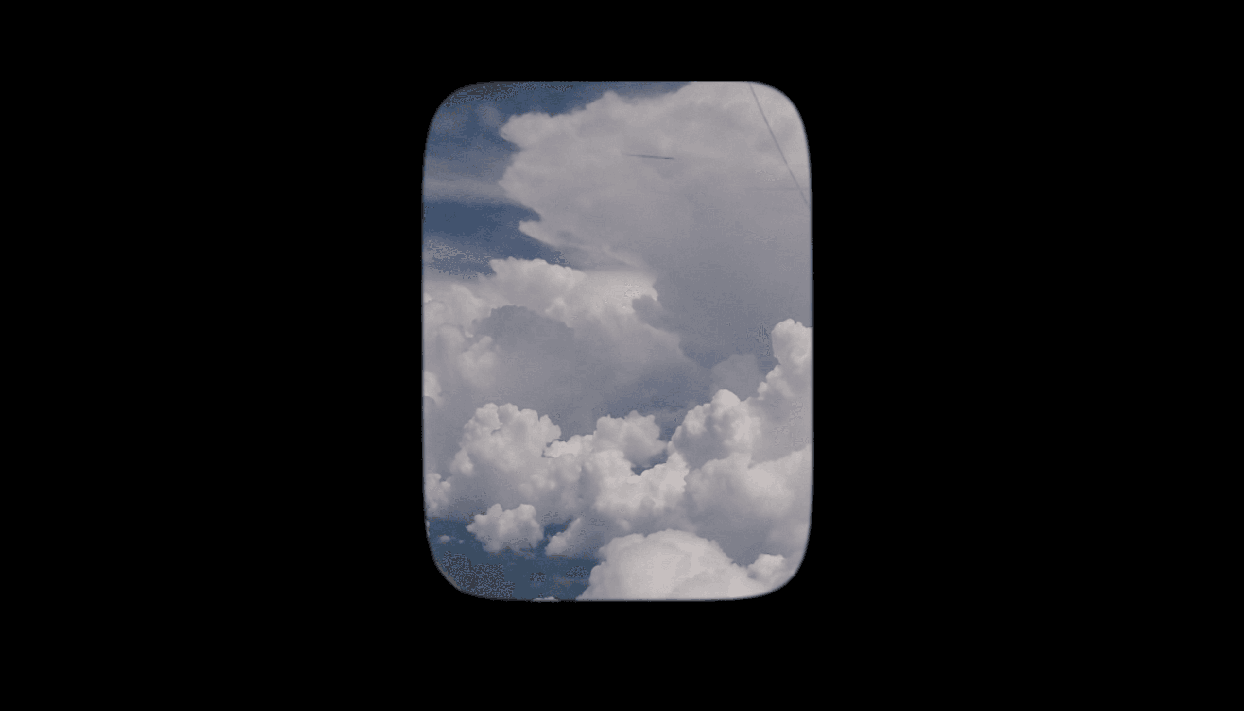 Sky is visible through an airplane window